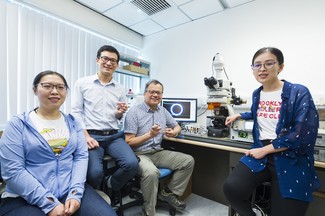 Generating ultra-violet lasers with near-infrared light through “domino upconversion” of nanoparticles