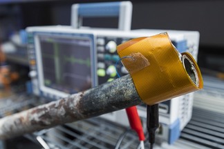 Non-destructive-testing based inspection system for defects in wall-covered pipes