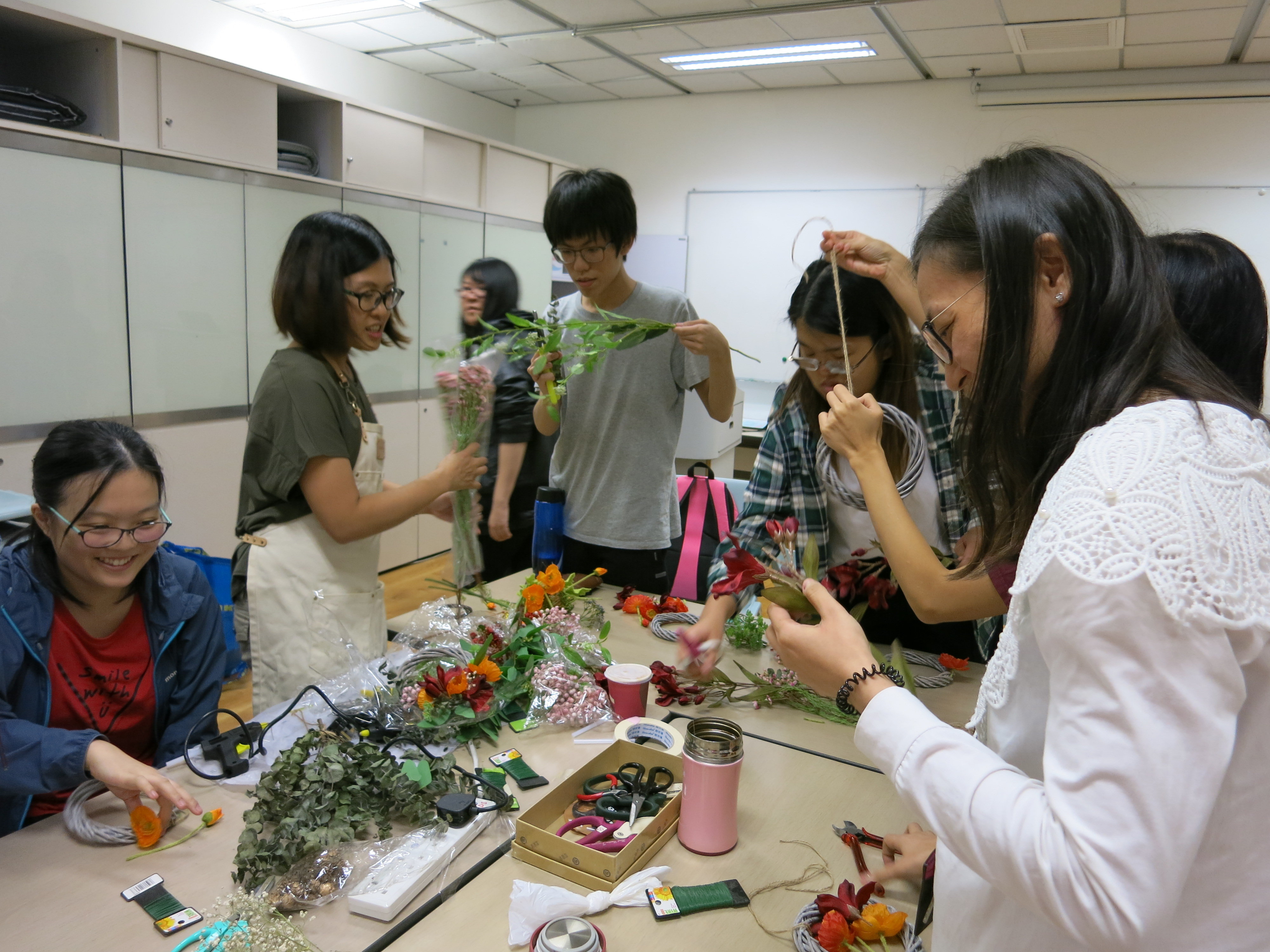 Students were enjoying making flower wreaths. 