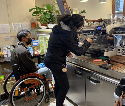 Student is trying to use coffee machine.