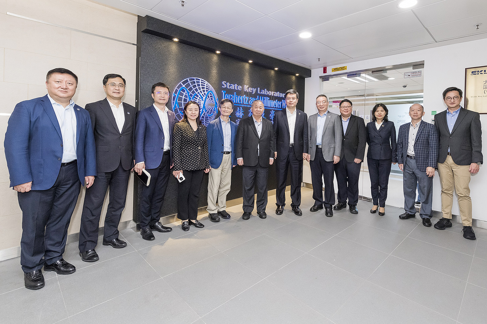 Welcoming the delegation led by Mayor Qin (sixth from right) are President Freddy Boey (sixth from left), Professor Chen Fu-rong (fifth from left), Professor Steve Wong Hang (first from right), Associate Vice-President (Community Engagement) and Deputy Director of the SKLTMW, Professor Luk Kwai-man (second from right), Founding Director of the SKLTMW, and Professor Kenneth Mei Yee Leung (fourth from right), Director of the SKLMP.