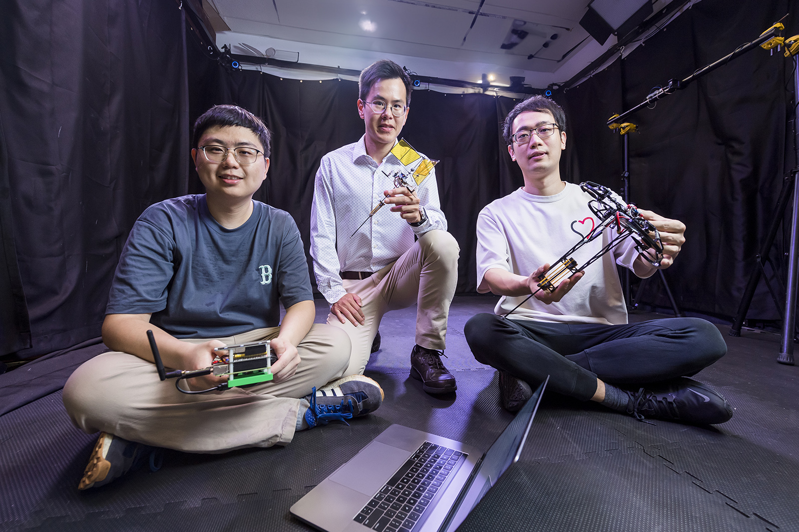 Professor Chirarattananon (centre); Dr Bai (right) and Dr Ding Runze, co-first authors of the paper.