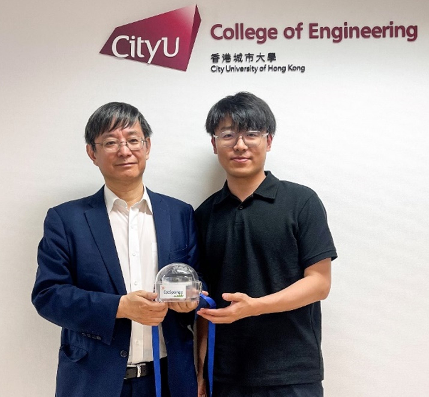 Research team with portable water treatment device.